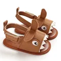 Detailed view of brown baby shark sandals with soft sole and velcro strap closure - Brown