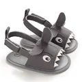 Detailed view of grey shark-themed baby sandals featuring soft soles and velcro straps - Gray
