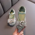Elegant green dress shoes for girls featuring a sparkly rhinestone bow and faux pearls. - 21 / Green