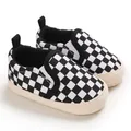 Detailed view of black and white checkered baby slip-on walker shoes with soft soles - Plaid