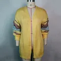 Detail of a yellow mohair cardigan with colorful striped sleeves on a dress form - S / Tops / Yellow