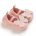 Close-up view of pink baby girl soft sole walker shoes with large butterfly decoration - Dark Pink