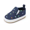 Navy blue infant canvas slip-on shoes featuring colorful dinosaur patterns and white sole - Blue