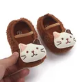 Close-up of cute brown plush baby shoes featuring a 3D cat face design - 11cm / Coffee Cat