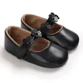 Detailansicht schwarzer Baby-Prinzessin-Lauflernschuhe mit Blumen und weichen Sohlen - Schwarz