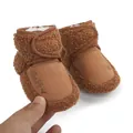Close-up of brown plush baby winter boots with heart embroidery - 11cm / 48g / Coffee