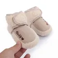 Close-up of soft fleece-lined baby winter boots with 'Baby' heart embroidery detail - Apricot