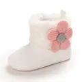 Detail of warm white baby snow boots with a pink flower decoration and soft anti-slip sole. - White