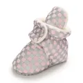 Close-up view of pink and silver checkered warm baby boot with soft faux fur lining. - Pink Gray
