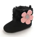 Close-up of baby winter boot with soft faux fur lining and pink flower ornament - Black