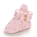 Close-up of pink fleece-lined baby snow boots with silver stars and wooden buttons - Insole Length 11cm / Pink