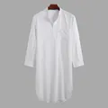 Detail view of men's white long sleeve button-up tunic with a curved hem - M / Robe / White