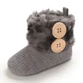 Warm gray knitted baby snow boots featuring soft faux fur trim and wooden buttons. - Gray