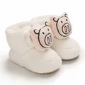 Detail view of white soft cotton baby shoes with cute pink pig cartoon character - Inner Length 11cm / White (Pig)