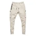 Front view of beige men's sports cargo joggers with multi-pocket design and zippers - Off White