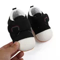 Detail view of breathable black mesh baby walking shoes with white toe cap - 11cm/Size 12 / Black