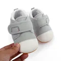 Detail of grey mesh baby walking shoes with white toe cap and anti-slip rubber sole. - Gray