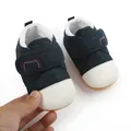 Close-up of navy blue mesh baby walking shoes with white toe cap and soft anti-slip sole - 11cm/Size 12 / Blue