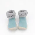 Macro view of cozy blue coral fleece baby sock shoes with cute embroidered cartoon faces - Size 18/19 / Sky Blue