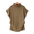 Detail view of the soft mock neck and loose batwing sleeves on a taupe brown T-shirt. - Camel