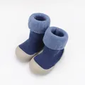 Close-up of blue knitted baby sock shoes with thick warm fleece lining and soft rubber soles. - Size 18/19 (11.5cm Inner Length) / Blue