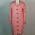Macro view of pink long hooded chunky knit cardigan featuring large black buttons and cuffs - S / Tops / Pink