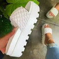 Detailed close-up of white woven platform slide sandal showing texture and thick sole - 35 / White