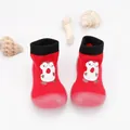 Detailed top view of red baby sock shoes with cartoon print and soft rubber soles - Red Cartoon Letter D