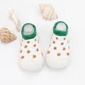 Close-up of baby walker sock shoes with cute orange cactus pattern and green cuff - White Carrot