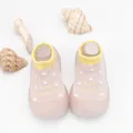 Close-up of breathable knit baby walker shoes with polka dots and soft rubber sole - Pink Letter