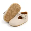 Detailed view of beige baby princess shoes featuring a pebble-textured rubber sole - 11cm / Papaya