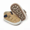 Detailed view of tan baby sandals with non-slip footprint pattern on the brown rubber sole - 11cm / Apricot