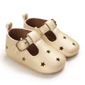 Macro detailed view of gold PU leather baby pre-walker shoes with star cutouts design - Gold