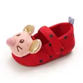 Detailed side view of red baby walking shoes with polka dots and cartoon mouse - Red