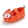 Detailed view of an orange baby walking shoe featuring white polka dots and a 3D plush fox head - Orange