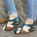 Detailed view of retro wedge sandals with cross straps and buckle in teal - 35 / Green