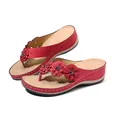 Detail view of red wedge thong sandals with decorative flowers and stitched sole - 36 / Red