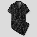 Detail view of men's black Hawaiian two-piece set with white linear print pattern. - L / Top And Bottom / Black