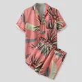 Detailed view of men's tropical palm leaf print short sleeve shirt and shorts set - L / Top And Bottom / Pink