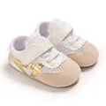 Close-up of white mesh baby walking shoes with gold stripes and beige suede toe box - Gold (Mesh)