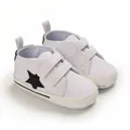 Soft sole white baby sneakers with black star detail and hook and loop straps. - White