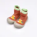 Soft sole orange baby sock shoes featuring a cute cartoon dinosaur pattern print - Size 24/25 / Orange Terry Cartoon