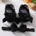 Detail view of black lace baby princess shoes and matching bow headband set. - Size 11 (Inner Length 10.5cm) / Black And Headband