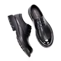 Close-up of men's breathable hollowed-out black leather shoes with thick soles - 38 / Black