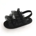 Close-up detail of infant black ruffled sandal with mesh fabric and elastic heel strap - Inner Length 11cm / Black