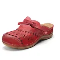 Close-up of red leather clogs featuring laser-cut floral patterns and decorative bow - 35 / Red