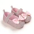 Detail view of pink glitter baby princess shoes with satin bow and non-slip soft sole. - Pink