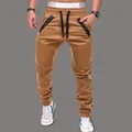 Close-up detail of men's khaki joggers featuring drawstring waist and pleated knee panels - M / Bottoms / Khaki