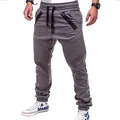 Detailed view of the pleated knee design and diagonal zippers on grey men's joggers. - M / Bottoms / Dark Gray