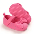 Detailed view of pink infant princess shoes with soft soles and a decorative bow. - Rose Red